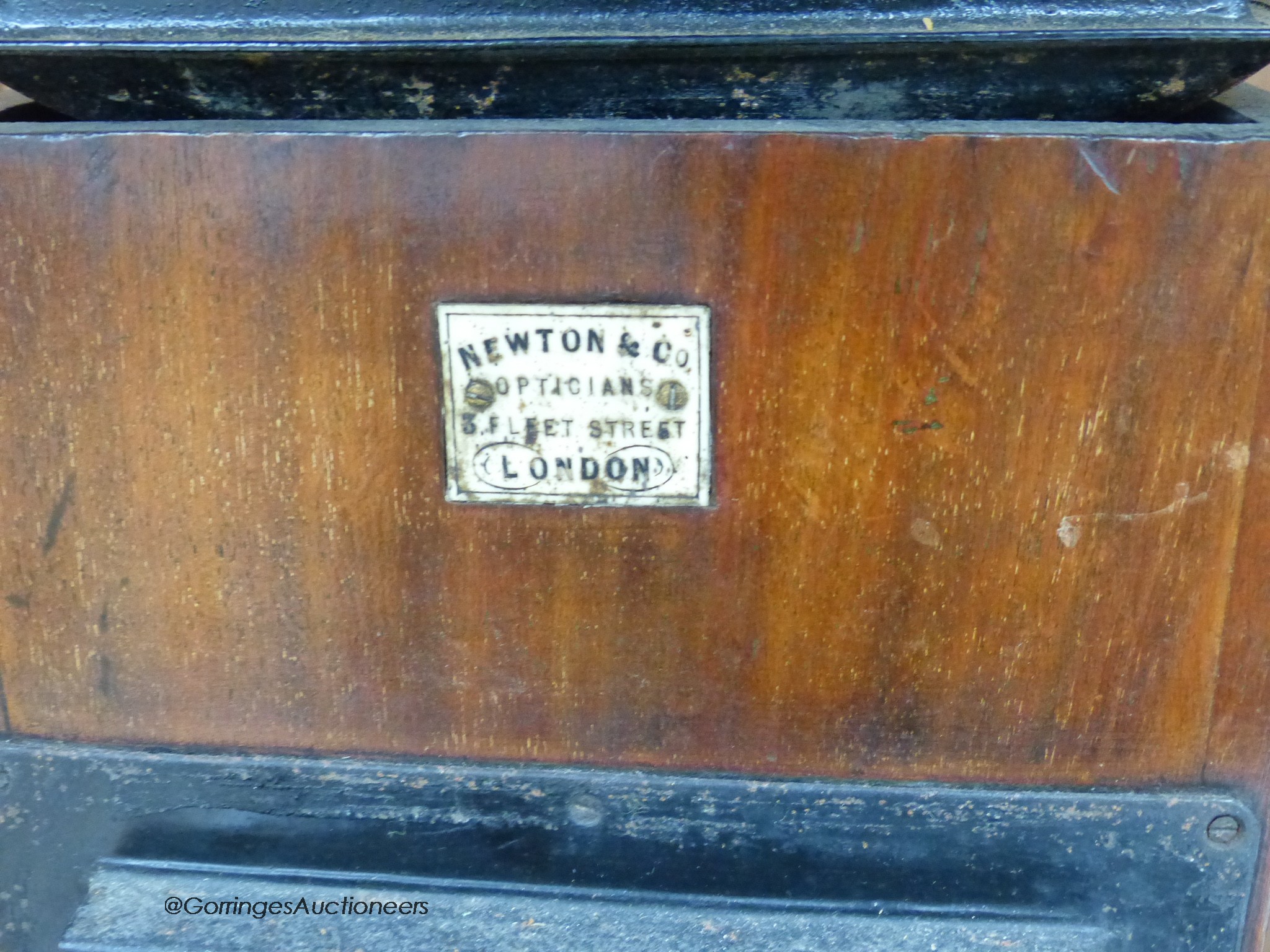 A Newton & Co Magic Lantern with slides and a group of three coconut domestic ladles